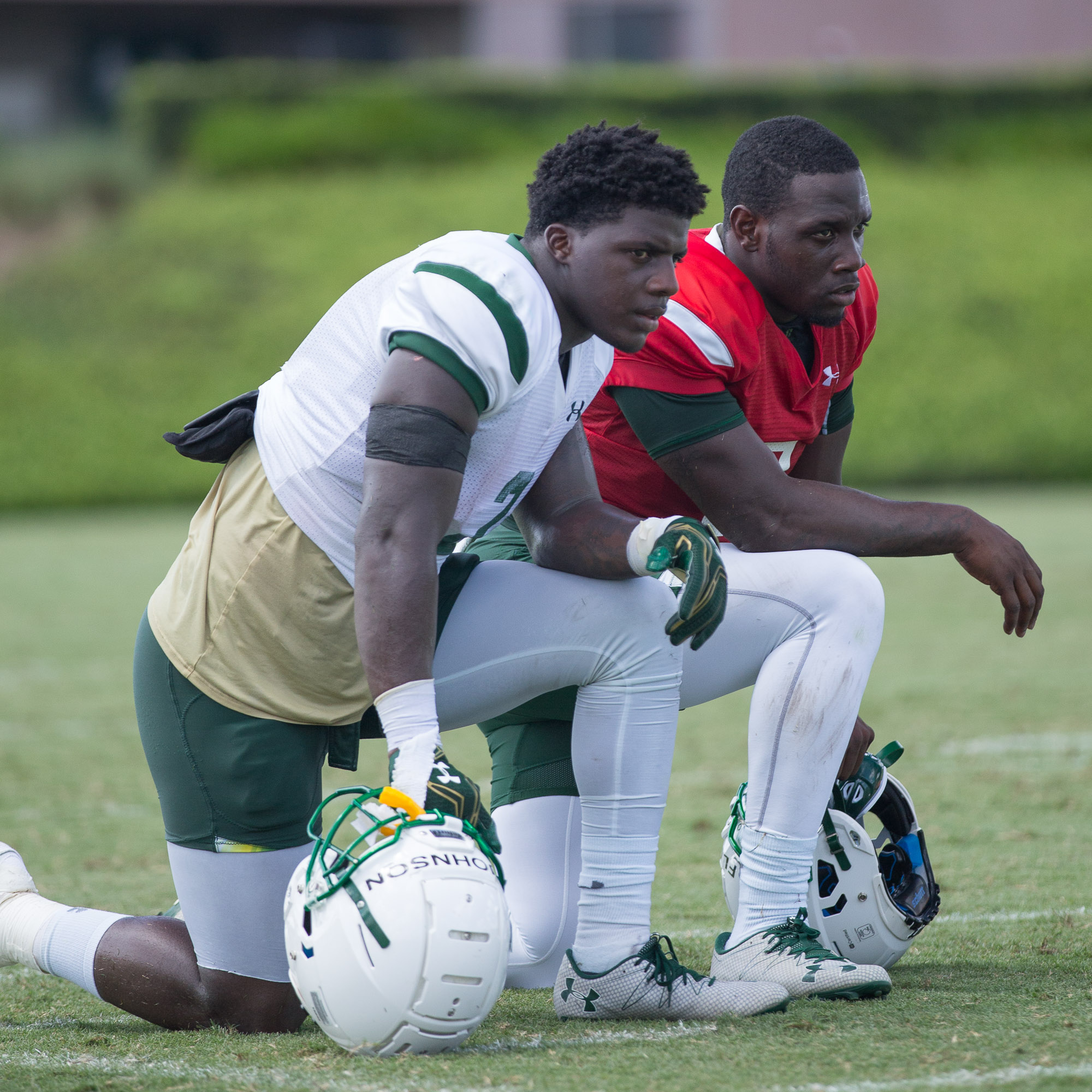 D'Eenest Johnson and Quinton Flowers take a knee during practice./STEVEN MUNCIE