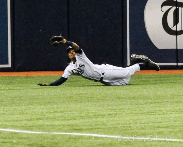 Mallex Smith leaves his feet to make the final out of the eighth./JEFFREY S. KING